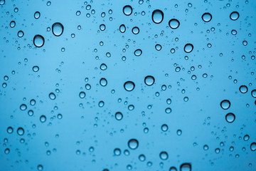 Fototapeta na wymiar Abstract macro photo background with water drops on glass