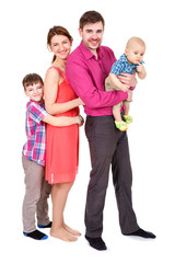 Fototapeta premium Pretty smiling family looking at the camera. Portrait of a happy four-member family Isolated on White Background. Father and Mother with childrens.