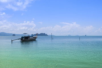  boat reflecting on sea. sea and beautiful cloud