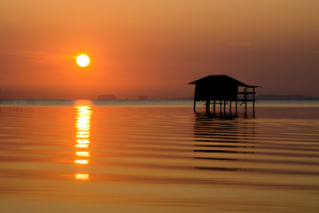 Fototapeta na wymiar Sunset sky on the lake in south of Thailand., un-focus image.