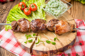 Delicious juicy skewered meat or shish kebabs on skewers of pork tenderloin