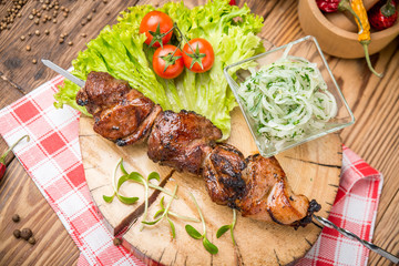 Delicious juicy skewered meat or shish kebabs on skewers of pork tenderloin