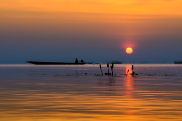Fototapeta premium Sunset sky on the lake in south of Thailand., un-focus image.