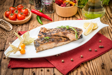 Fried fish carp on the grill