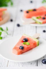 Watermelon popsicles with bluberry. Sweet snack concept. Selective focus