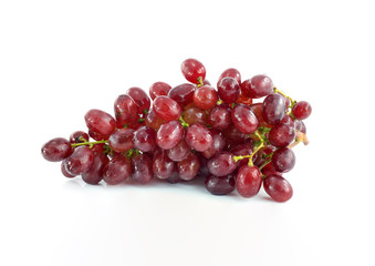 Ripe red grape. Pink bunch with leaves isolated on white. With clipping path. Full depth of field.