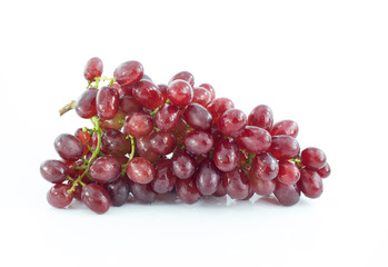 Ripe red grape. Pink bunch with leaves isolated on white. With clipping path. Full depth of field.