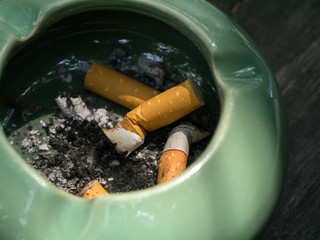 Close up of old cigarette in an ashtray.