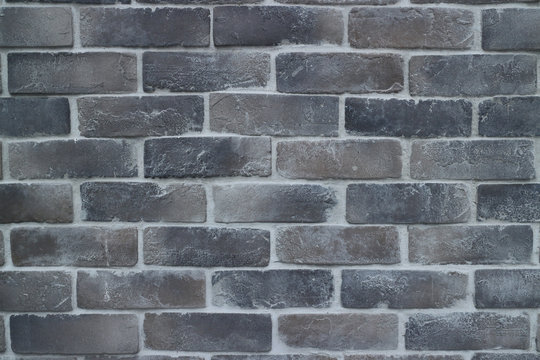 grey brick wall with cement grout texture