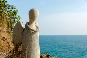 Guardian angel statue on the cliffs of the island, Thailand.