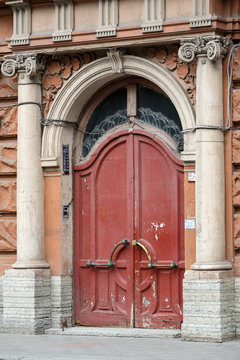 The main entrance to the revenue building of I. I. Dernov, also called the "tower house" (built in 1903-1905 in eclectic style). Tavricheskaya street, Saint Petersburg, Russia.