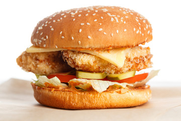 Big tasty chicken burger wooden table.