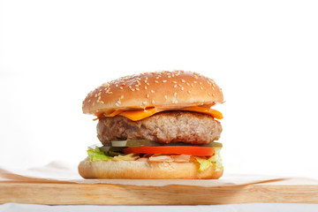 Big tasty burger with meat Patty wooden table.