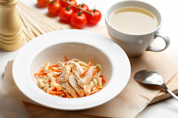 Close up of classic chicken noodle soup.