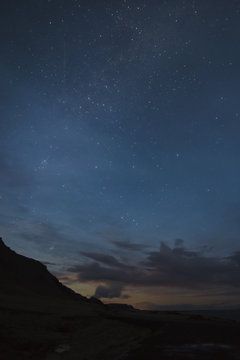 Starry night in the mountains, vertical photo