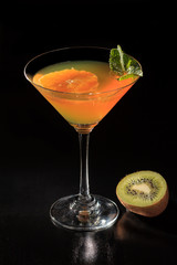 Orange jelly with lime pieces in the glass topped mint leaves
