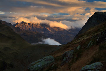 Colorful sunset over mountains and lake