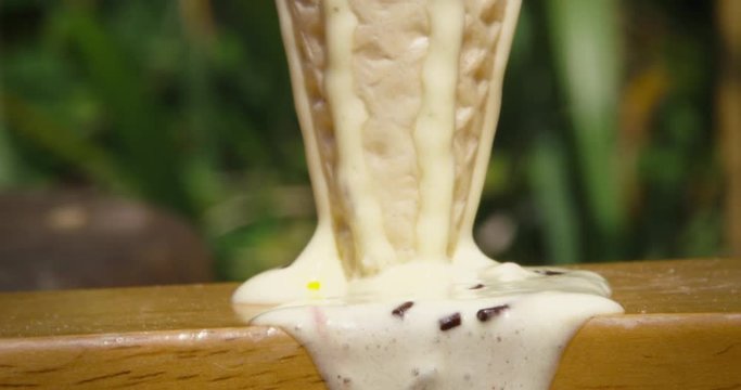 Melting ice cream wafer cone on hot sunny summers day