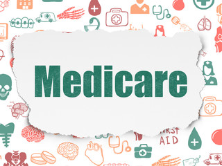 Medicine concept: Medicare on Torn Paper background