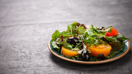 Fresh Green mix Salad with Vegetables, Tomatoes and Microgreen.Leaves Of Spinach,Arugula,Romaine,Lettuce.Concept of Healthy Food.Vegetarian.Copy space for Text. selective focus.
