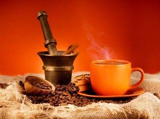 Coffee cup and vintage mortar