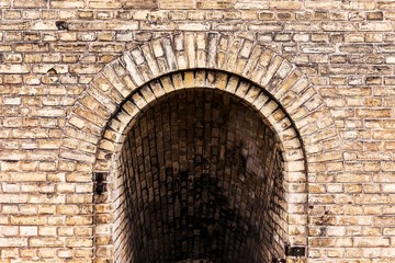old ancient brick wall vault tunnel grunge background