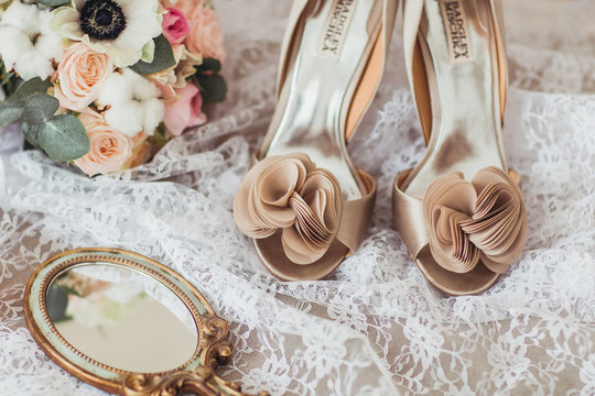 Luxury shoes and bride jewel on the sofa