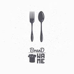 Hand drawn silhouette of spoon and fork. Restaurant logo template for craft food packaging, menu or brand identity