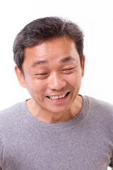 Obraz premium happy middle aged man smiling, white isolated background