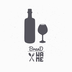 Hand drawn silhouette of wine bottle and glass. Liquor store logo template for craft food packaging or brand identity