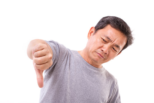 unhappy, unsuccessful, negative middle aged man showing thumb down