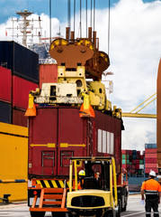 Industrial crane loading Containers in a Cargo freight ship