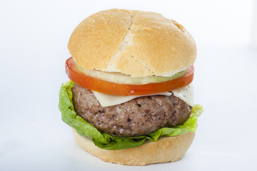 Giant homemade burger classic american cheeseburger isolated on white