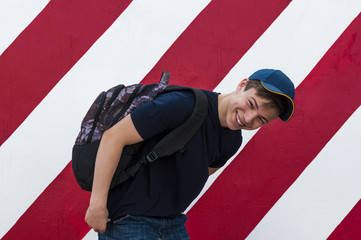 Fototapeta na wymiar Stylish young man on a bright wall background