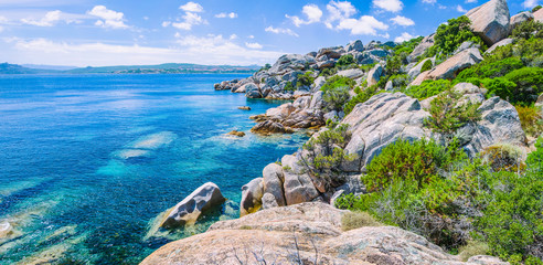 Bizarre granite rocks and amazing azure water on beautiful Sardinia island near Porto Pollo,...