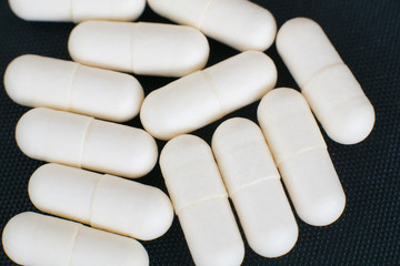 Pharmacy theme, white medicine pills isolated on white background