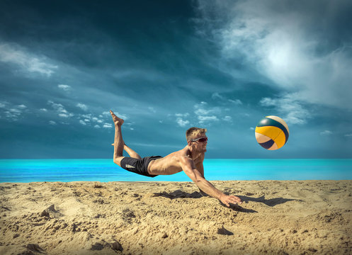 Beach Volleyball player in sunglasses under sunlight. Dynamic sp