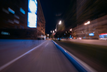 Fototapeta na wymiar Blurred lights, view of the road, shooting at long exposure.