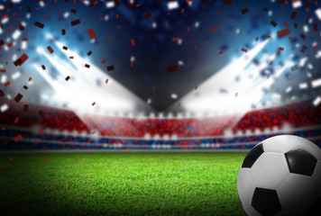 Soccer ball on football field in stadium with light