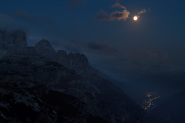 Dolomites fullmoon over village