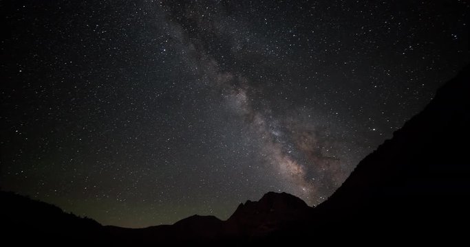 The stars and Milky Way move across the night sky.
