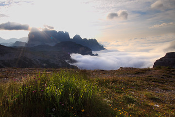 Dolomites sunrise above clouds