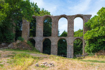 Fototapeta na wymiar Monterano (also known as Ancient Monterano) is a ghost town in Italy , located in the province of Rome, perched on the summit plateau of the hill tuff.