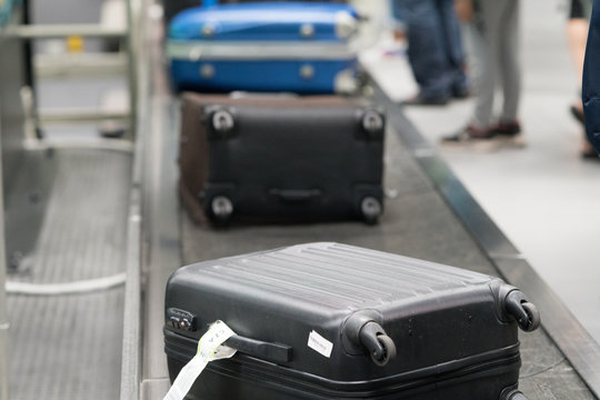 Luggage on conveyor belt at baggage claim