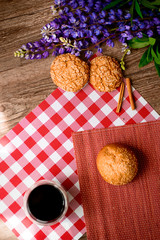 bread and coffee,flowers on the table in the morning