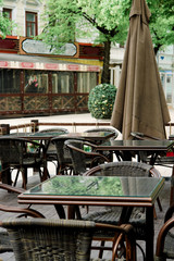 Chairs and tables on summer terrace on outdoor cafe