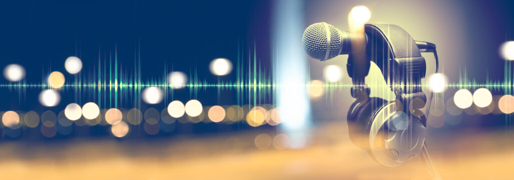 Music background.Microphone and headphones.Live music and blurred stage lights
