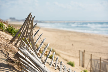 Wooden fence on Atlantic beach in France