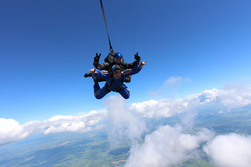 Tandem skydiving in the blue sky