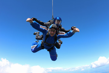 Tandem skydiving in the blue sky